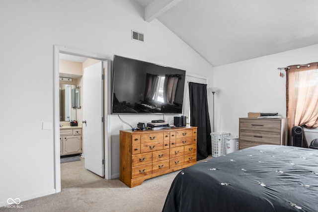 bedroom featuring high vaulted ceiling, light colored carpet, beamed ceiling, and ensuite bathroom