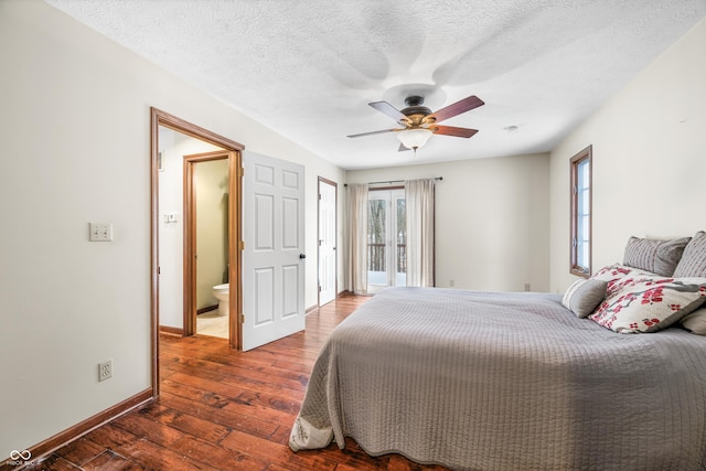 bedroom featuring ceiling fan, connected bathroom, dark hardwood / wood-style floors, and a textured ceiling