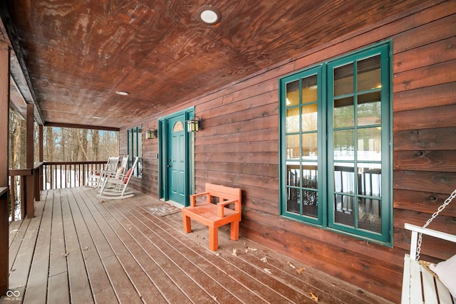 wooden deck featuring covered porch