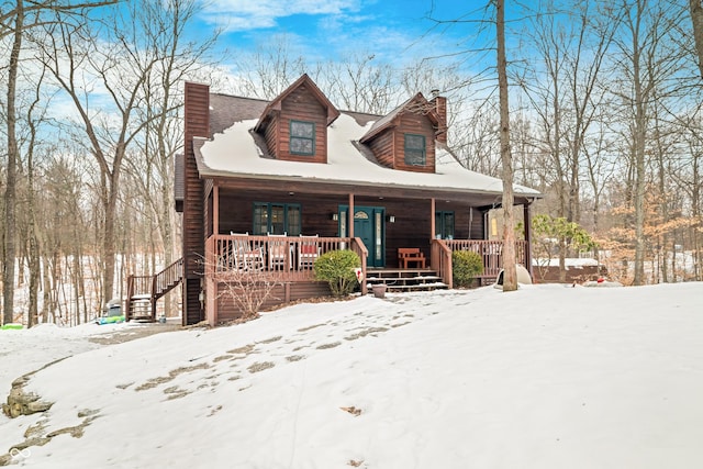 log cabin with covered porch