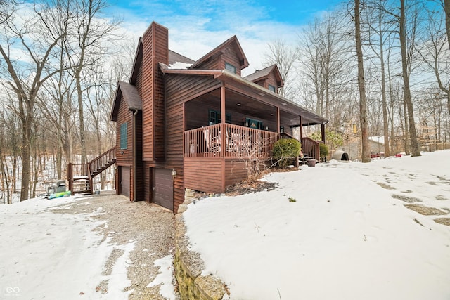 exterior space featuring a garage and a porch