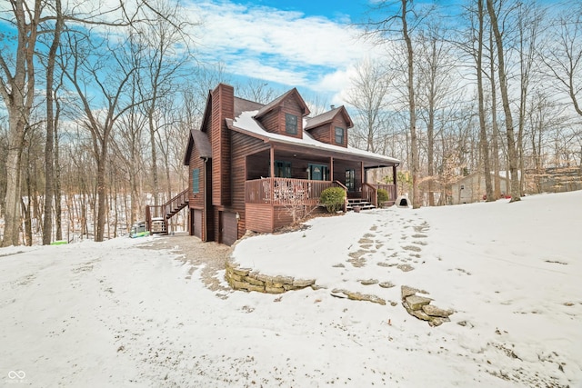 exterior space featuring a garage and covered porch