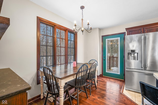 dining room featuring an inviting chandelier and wood-type flooring