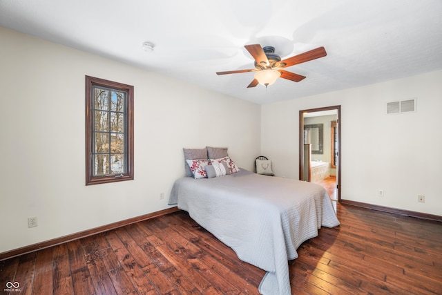 bedroom with dark hardwood / wood-style floors, connected bathroom, and ceiling fan