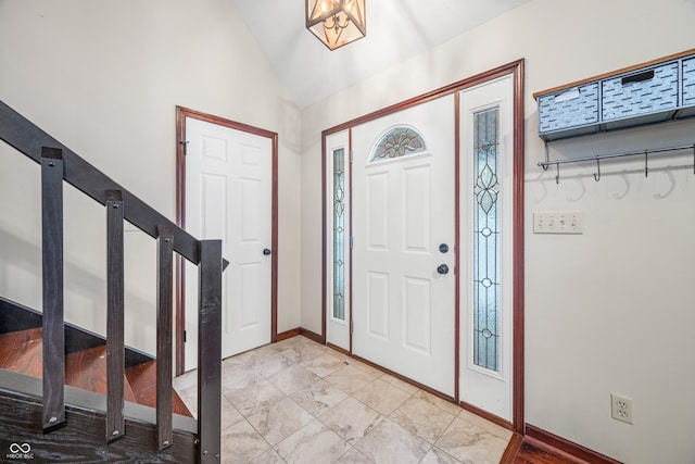 entrance foyer with vaulted ceiling