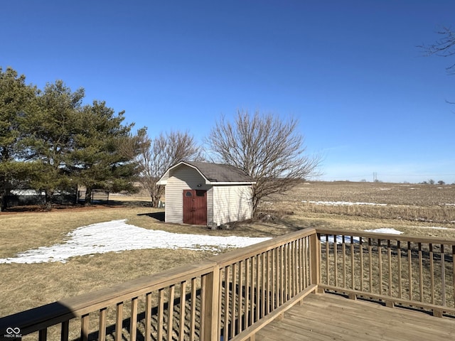 wooden deck with a storage shed