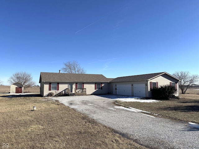 single story home with a garage and a front yard