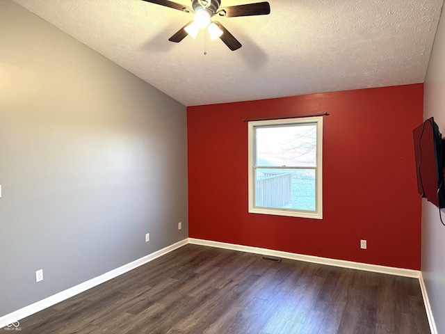 spare room featuring ceiling fan, a textured ceiling, and dark hardwood / wood-style flooring