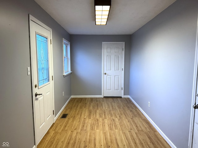 foyer with light hardwood / wood-style floors