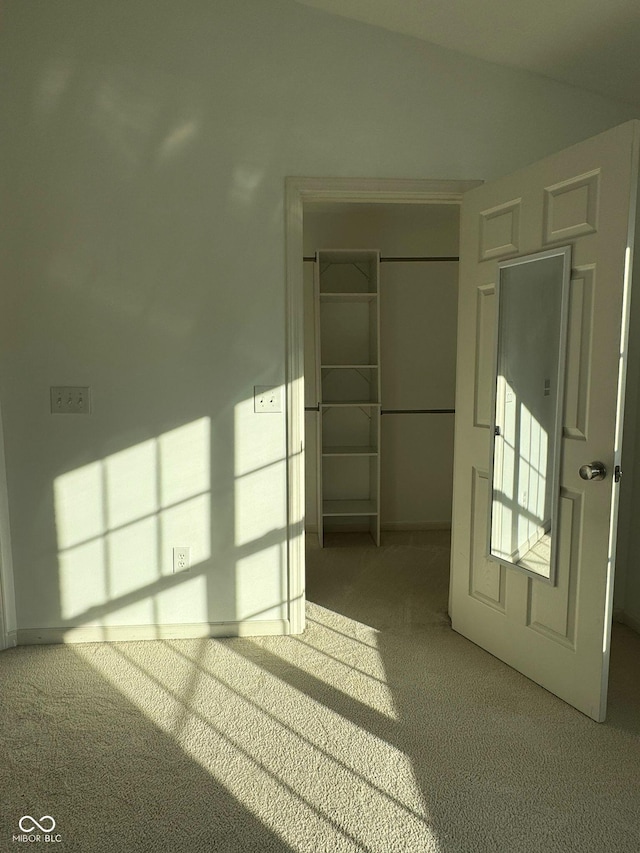 empty room featuring light carpet