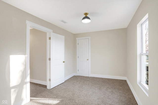 spare room with carpet flooring