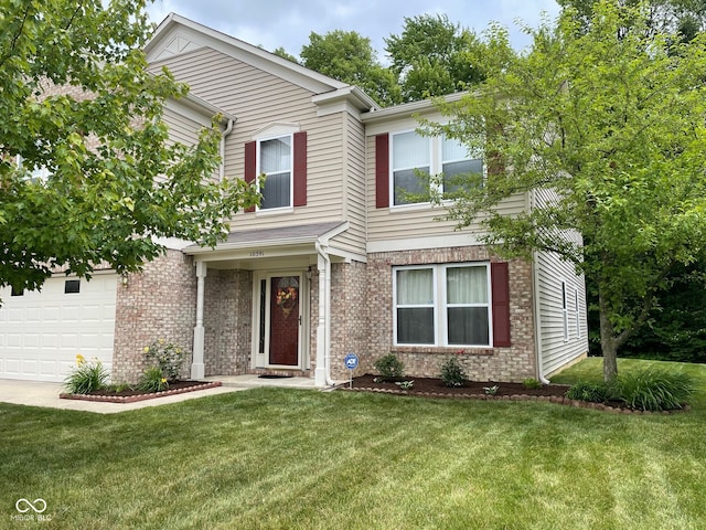 view of front of home with a garage and a front yard