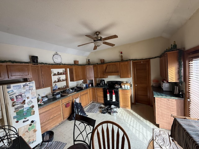 kitchen featuring vaulted ceiling, ceiling fan, black electric range, and white fridge