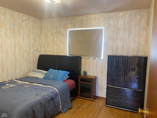 bedroom featuring hardwood / wood-style floors