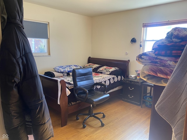 bedroom with light hardwood / wood-style floors