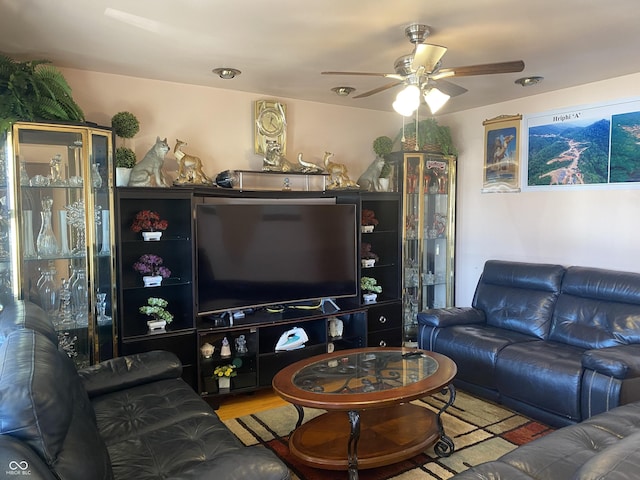 living room featuring hardwood / wood-style flooring and ceiling fan