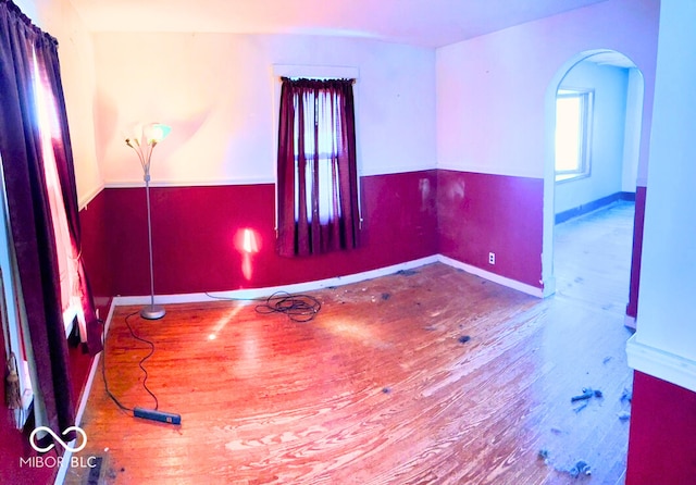 empty room with hardwood / wood-style floors