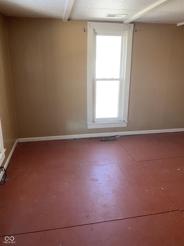 empty room featuring a textured ceiling