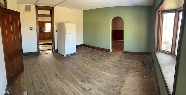 spare room with dark hardwood / wood-style floors