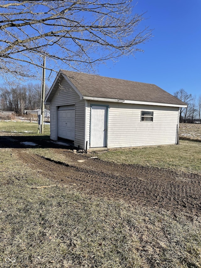 garage featuring a yard