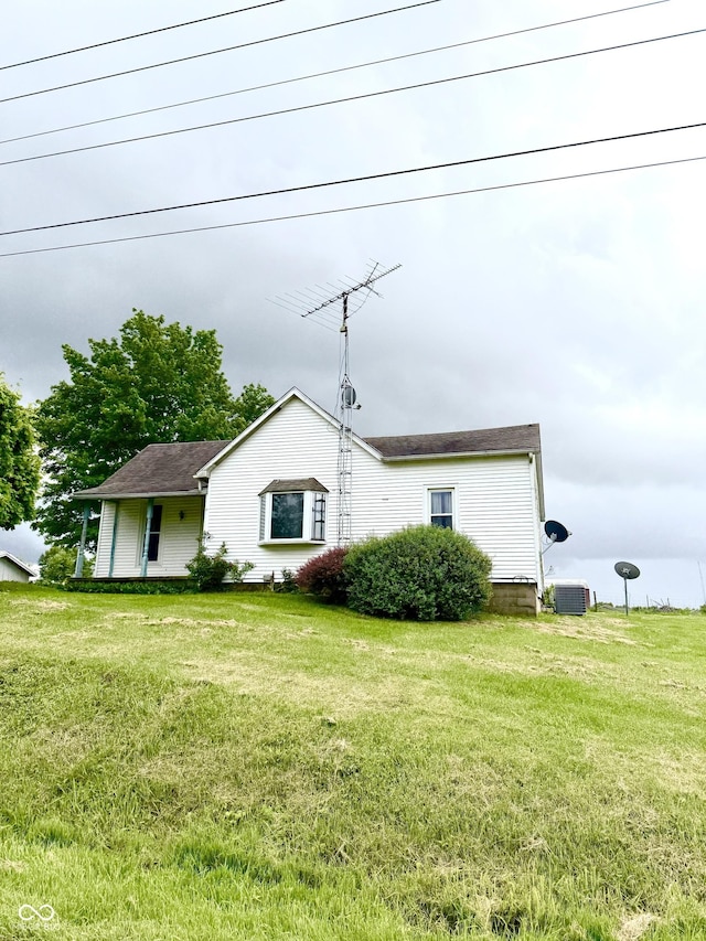 5915 W County Road 300 N, North Vernon, IN 47265 - view of side of home featuring a lawn and central air condition unit