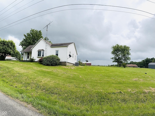 5915 W County Road 300 N, North Vernon, IN 47265 - view of home's exterior with central AC and a lawn