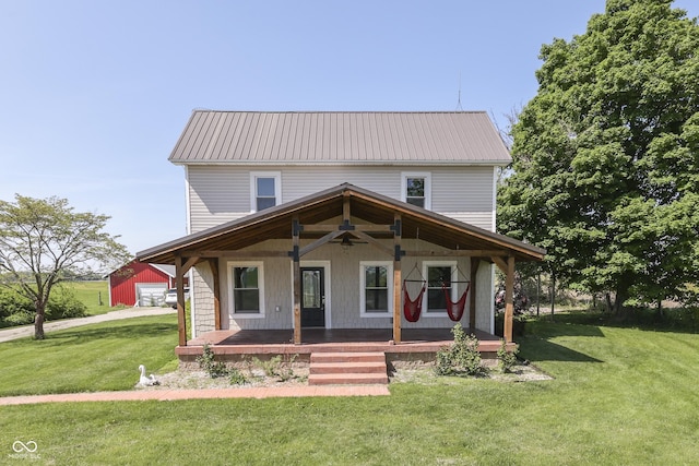 5750 W 300th Rd N, Bargersville, IN 46106 - country-style home featuring covered porch, ceiling fan, metal roof, and a front yard