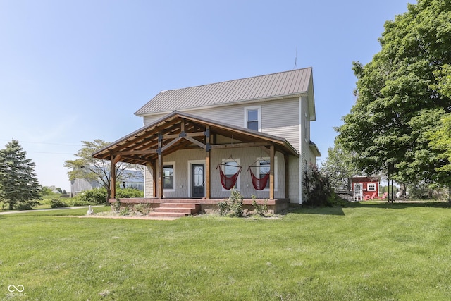 5750 W 300th Rd N, Bargersville, IN 46106 - view of front of house featuring a porch, a front lawn, and metal roof