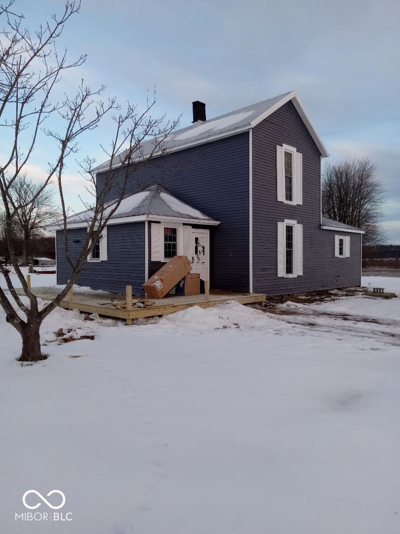 view of snow covered house