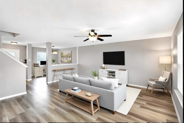 living room with hardwood / wood-style floors and ceiling fan