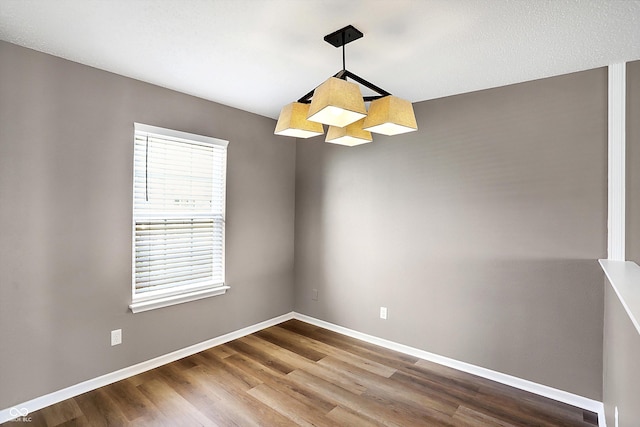 spare room with hardwood / wood-style flooring