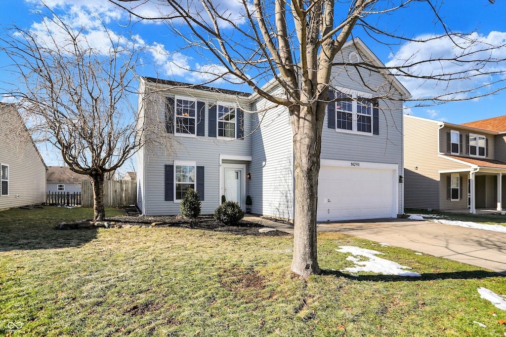 view of front of property featuring a garage and a front yard