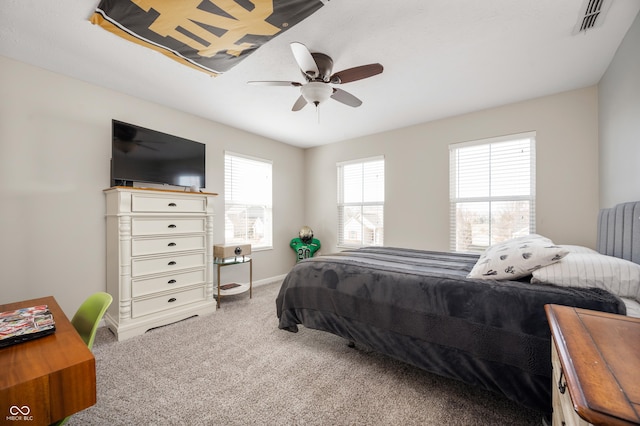 carpeted bedroom with ceiling fan