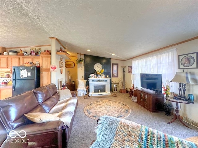 living room featuring a fireplace, ornamental molding, a textured ceiling, and carpet flooring