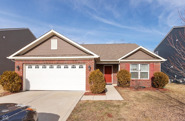 ranch-style home with a garage and a front lawn