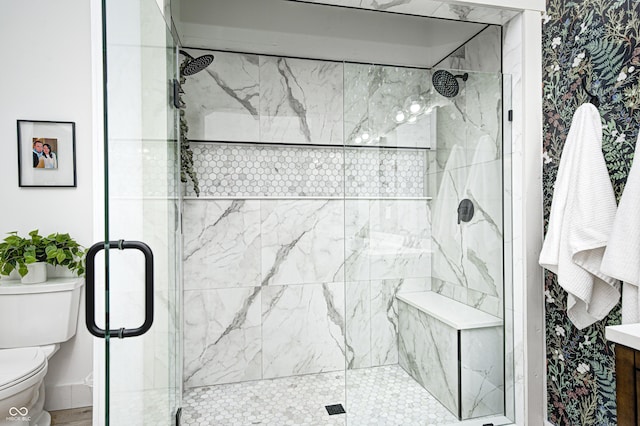 bathroom with an enclosed shower and toilet