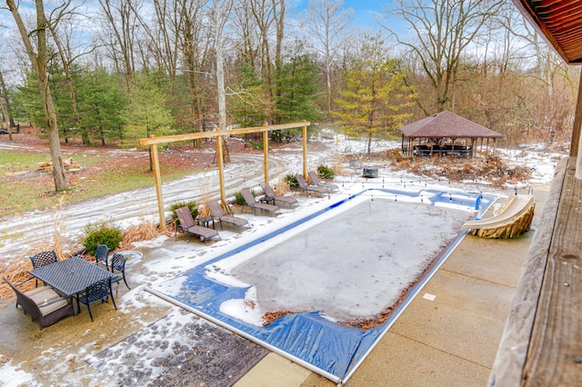 view of swimming pool with a gazebo