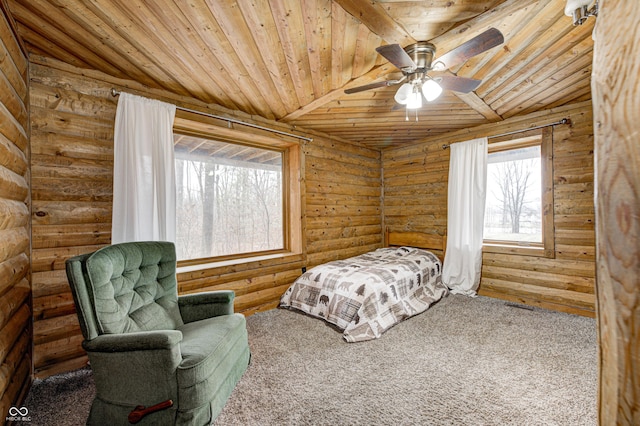 bedroom with ceiling fan, wood ceiling, and rustic walls