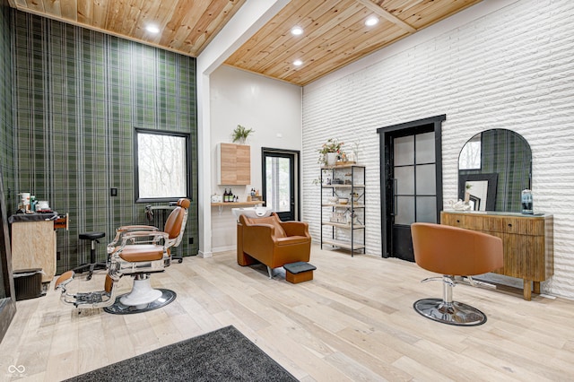 interior space featuring a high ceiling, wood-type flooring, and wooden ceiling