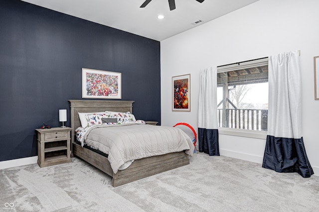 bedroom with light carpet and ceiling fan