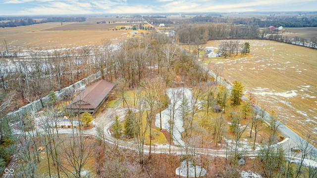 snowy aerial view featuring a rural view