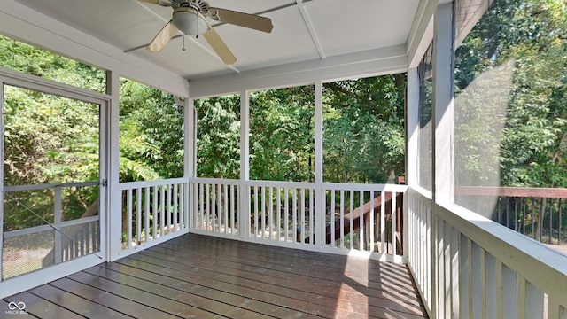 unfurnished sunroom featuring ceiling fan