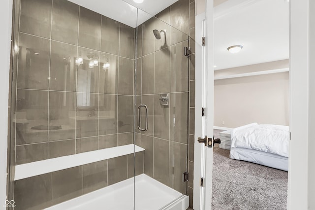 bathroom featuring a shower with door