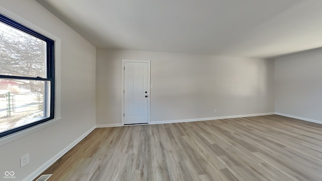 empty room with light wood-type flooring