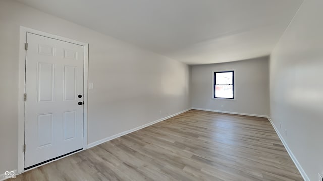 spare room featuring light wood-type flooring