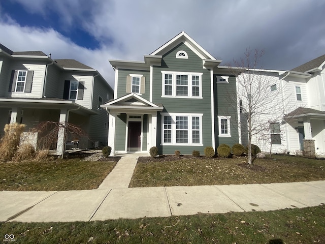 view of front of home with a front lawn