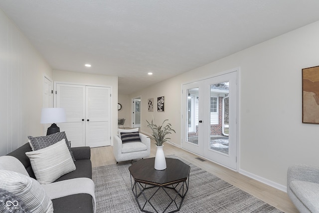 living room featuring hardwood / wood-style floors and french doors