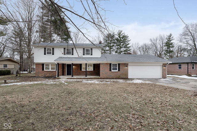 view of front property with a garage and covered porch