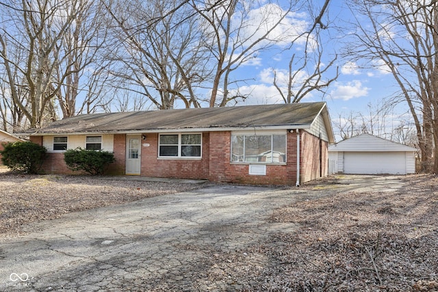 single story home with an outbuilding and a garage