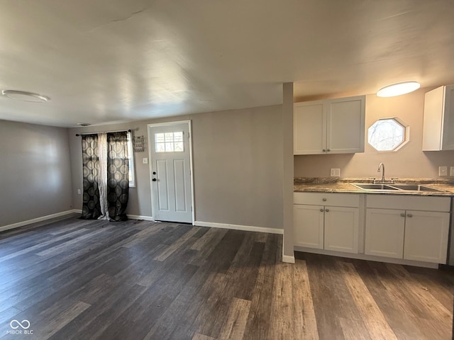 kitchen with sink, dark wood-type flooring, and white cabinets